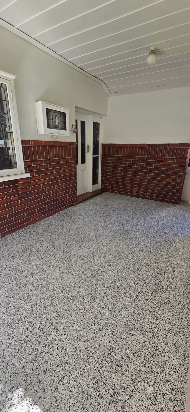 Black and white flake epoxy on a home entry porch